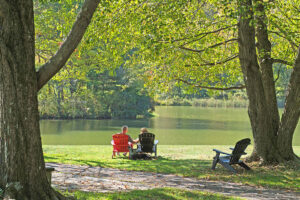 couple at abbott lake in adirondak chairs